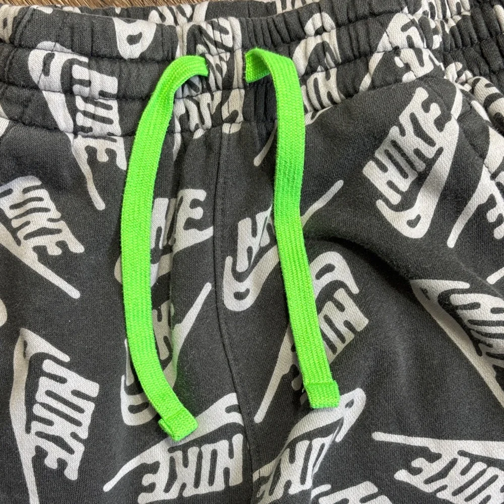 Nike Club Black Jogger Pants with White Logo Print and Neon Green Drawstring